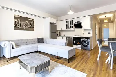 a living room with a couch and a table at NIŞANTAŞI JANTY LUXURY, 4 NEW APARTMENTs in Istanbul
