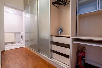 a walkin closet with a glass door and a shower at Spacious Dublex in Cihangir in Istanbul