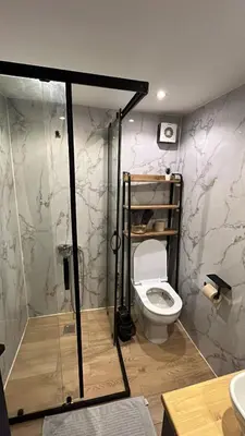 a bathroom with a toilet and a shower stall at Bisanthe Panorama in Kumbağ