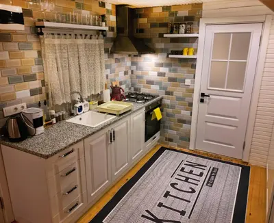 a kitchen with a sink and a stove top oven at Bisanthe Panorama in Kumbağ