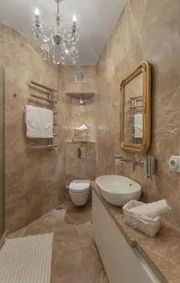 a bathroom with a sink and a toilet and a mirror at Doctors Spacious Place in Istanbul