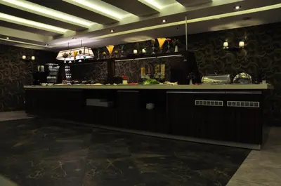 a bar in a restaurant with a counter at Royal Hotel Inegol in Inegol