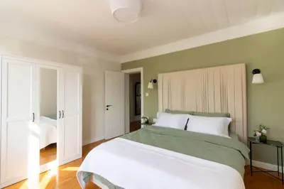 a bedroom with a large bed with white pillows at Historic 2BR Gem in Downtown Sisli AC in All Rooms in Istanbul