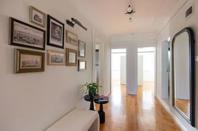 a living room with a couch and a mirror at Historic 2BR Gem in Downtown Sisli AC in All Rooms in Istanbul