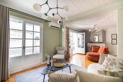 a living room with a couch and a table at Historic 2BR Gem in Downtown Sisli AC in All Rooms in Istanbul