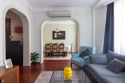 a living room with a couch and a table at Tasteful & Spacious 3BR Haven in Trendy Şişli in Istanbul