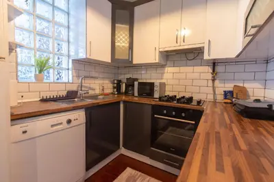 a kitchen with a sink and a stove top oven at Tasteful & Spacious 3BR Haven in Trendy Şişli in Istanbul