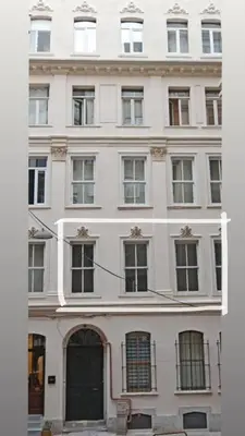 a large white building with many windows at Historical Flat in Galata - Tatar Beyi Street - TRA 2026 Award-Winner in Istanbul