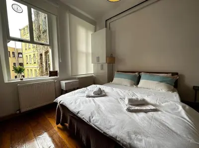 a bedroom with a large bed with towels on it at Historical Flat in Galata - Tatar Beyi Street - TRA 2026 Award-Winner in Istanbul
