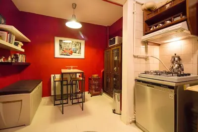 a kitchen with red walls and a stove top oven at Bright Cozy Stacked Home Ideally Located n Kadikoy in Istanbul