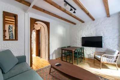 a living room with a couch and a table at Authentic 1BR w Private Patio in Hype Cihangir in Istanbul