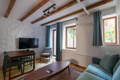 a living room with a couch and a table at Authentic 1BR w Private Patio in Hype Cihangir in Istanbul