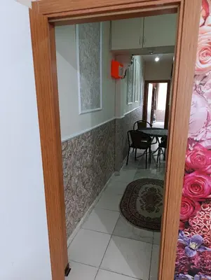 a door leading into a dining room with a table at Merkez İstanbul in Istanbul