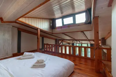 a bedroom with a large white bed with a window at Kuzguncuk Retreat W Stunning Views and Local Charm in Istanbul