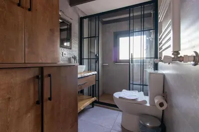 a bathroom with a toilet and a sink at Kuzguncuk Retreat W Stunning Views and Local Charm in Istanbul