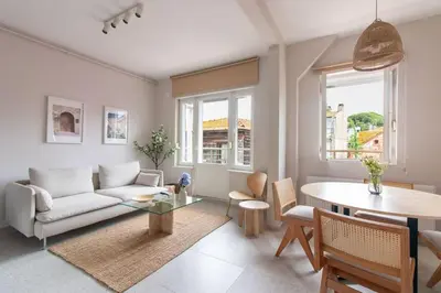 a living room with a couch and a table at 2BR Flat W Modern Touches in Adalar