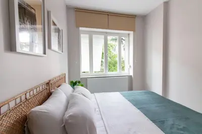 a bedroom with a bed and a window at 2BR Flat W Modern Touches in Adalar