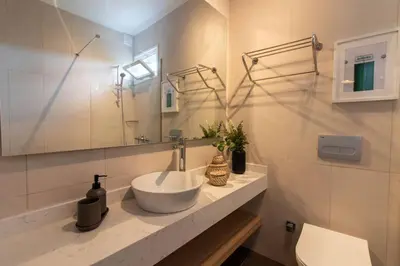 a bathroom with a sink and a mirror at 2BR Flat W Modern Touches in Adalar