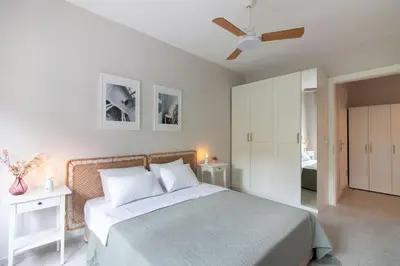 a bedroom with a bed and a ceiling fan at 2BR Flat W Modern Touches in Adalar