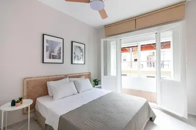 a bedroom with a bed and a large window at 2BR House W Island Charm in Adalar