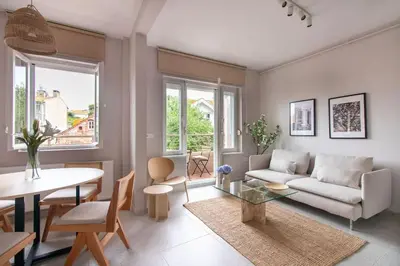 a living room with a couch and a table at 2BR House W Island Charm in Adalar