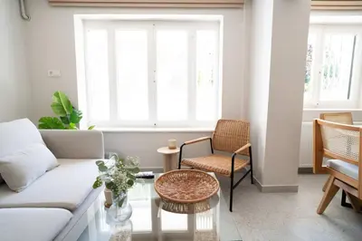 a living room with a couch and a table at 2BR Designed Flat In The Center of Buyukada in Adalar
