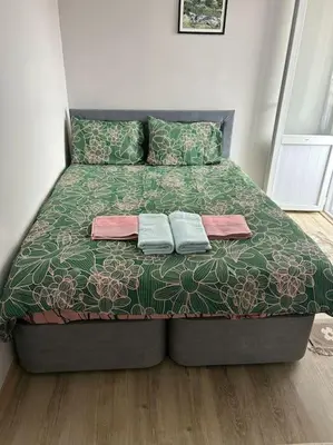 a bed in a bedroom with two towels on it at Üsküdar - Venüs home - Sakin Konaklama in Istanbul