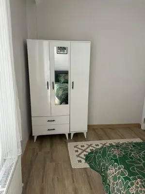 a white cabinet with a mirror in a room at Üsküdar - Venüs home - Sakin Konaklama in Istanbul