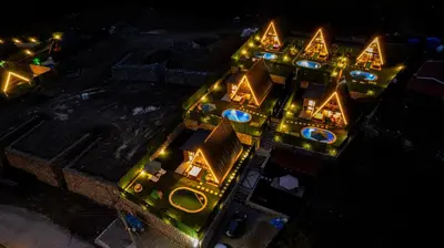 an overhead view of a building with lights on it at Happy Enjoy Bungalow in Sapanca