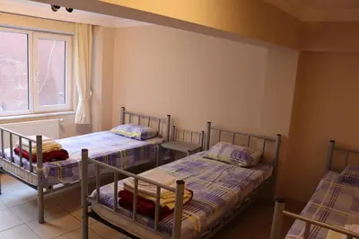 two bunk beds in a room with a window at Hostelist in Istanbul
