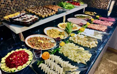 a buffet with many different types of food on a table at Aven Hotel in Istanbul