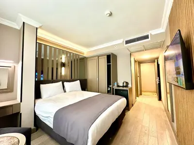 a bedroom with a large bed in a room at Aven Hotel in Istanbul