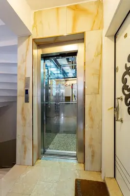 an elevator in a building with a glass door at Modern Suites Galata in Istanbul