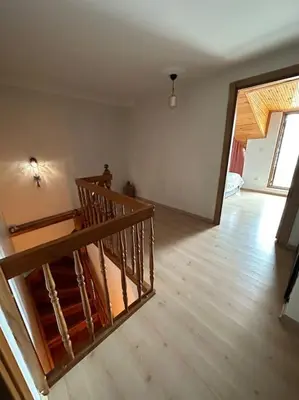 an empty room with a staircase in a house at Dublex roof top with AC, perfect location in Istanbul