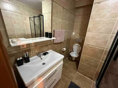 a bathroom with a sink and a toilet at Dublex roof top with AC, perfect location in Istanbul