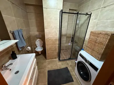 a bathroom with a shower and a toilet and a sink at Dublex roof top with AC, perfect location in Istanbul