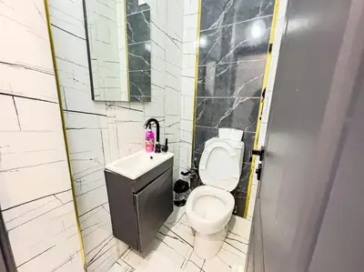 a small bathroom with a toilet and a sink at شقه الأحلام بمنطقة شيشلى 341 in Istanbul