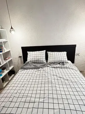 a bedroom with a bed with a white tiled floor at i1 House Hotel in Istanbul