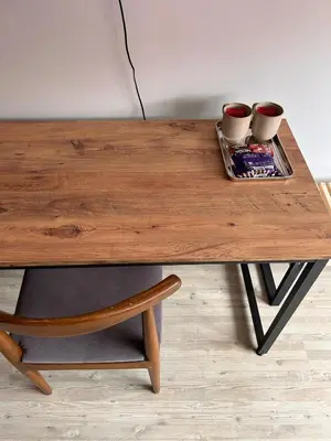 a wooden table with two cups on a tray at i1 House Hotel in Istanbul