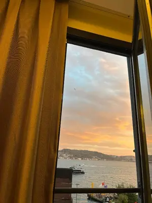a window with a view of the water at Lokka Hotel Ortakoy in Istanbul