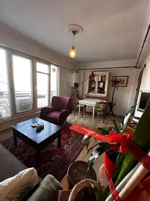 a living room with a couch and a table at Cozy Flat to Taxim, Beyoglu, Pera, Galata in Istanbul