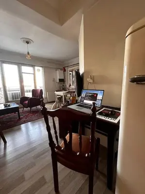 a room with a desk with a laptop computer on it at Cozy Flat to Taxim, Beyoglu, Pera, Galata in Istanbul