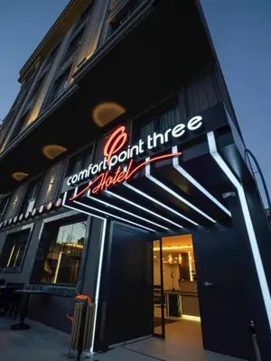 a sign on the side of a building with ainioninioninioninioninion three at Modernlux Hotel in Istanbul