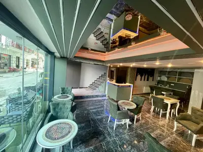a restaurant with chairs and tables in a room at Grand Hurriyet Hotel in Istanbul