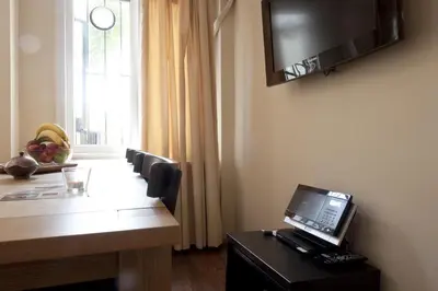 a room with a desk with a laptop computer on it at Spacious Balcony Suite Sultanahmet - Aslan Apartments in Istanbul