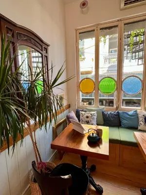 a room with a couch and a table with a laptop at Levant Pension de Luxe in Istanbul