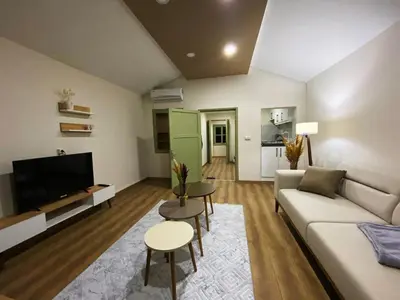 a living room with a couch and a tv at Özkanlar in Istanbul