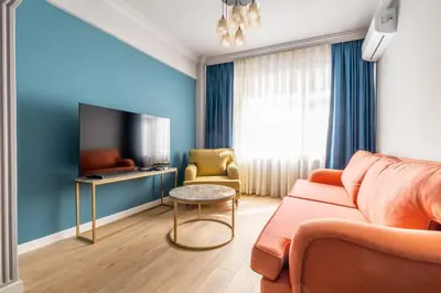 a living room with a couch and a tv at Mayer Beyoglu Apartments in Istanbul
