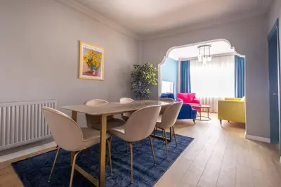 a living room with a dining room table and chairs at Mayer Beyoglu Apartments in Istanbul