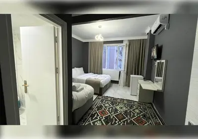 a hotel room with two beds and a television at Anka Boutique Hotel in Istanbul